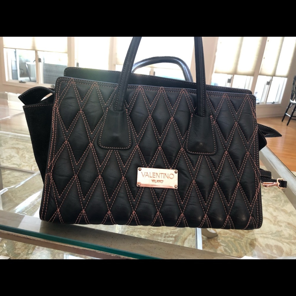 Valentine black leather handbag with stitching.